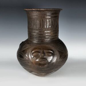 Dan Incised Storage Pot with Modeled Faces